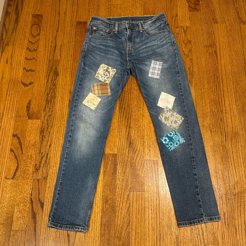 Levi’s 502 30 x 32 with custom vintage fabric patches.